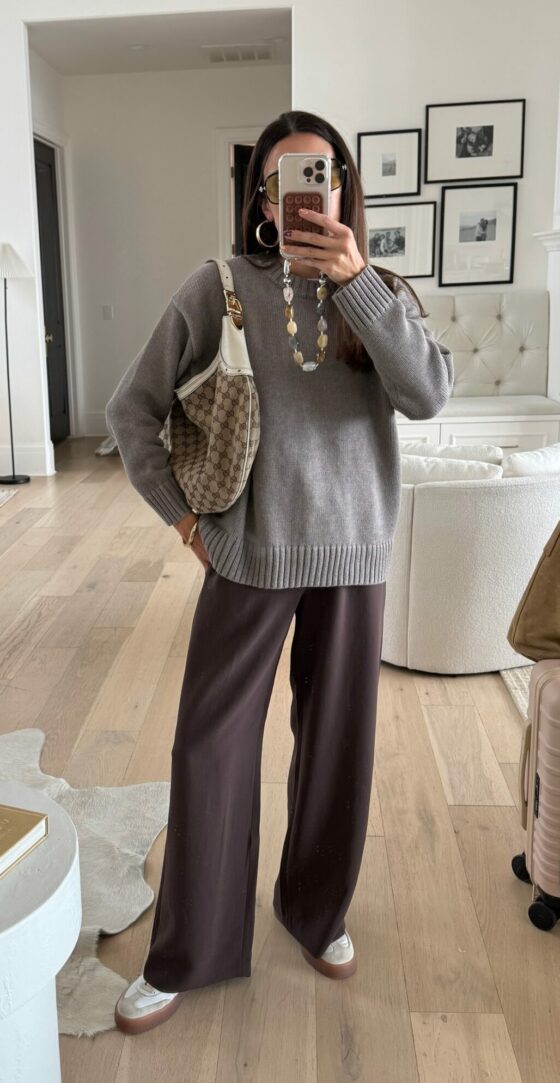 Christine Andrew in a fall outfit gap sweater and aritzia pants